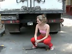 Cutie pissing right through sporty pants...