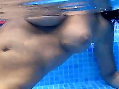 Underwater strip of beautiful breasts