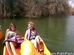 Girls going boating do some flashing