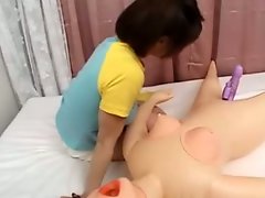Oriental babe sensual sucking on sex dolls vibrator