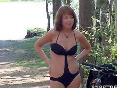 Swimsuit and dress modeling teen outdoors