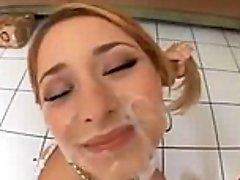 Cute Blonde Takes A Facial From Two Cocks