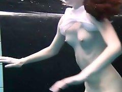 Shaved vagina brunette in the pool