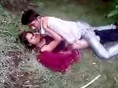 Indian couple fools around in the grass