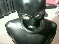 Amazing slave girl in provocative latex mask is addicted to sex toys