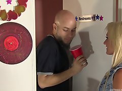 Wild hottie with bleach blonde hair sucks dick at a gloryhole