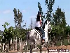 Babe from Thailand riding a horse