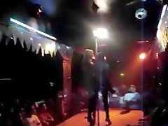 Super-sexy stripper gets a lucky dude up on the stage and humps his bare cock