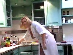 Milf in a robe showing tits in kitchen