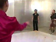 Throwing eggs at a chick in a helmet