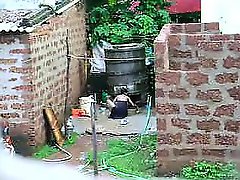 Watch this two hot Sri Lankan lady getting bath in outdoor